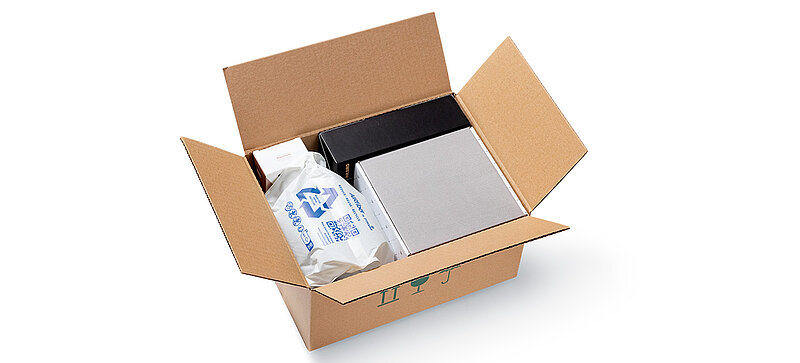 A shipping carton with products and air pillows made of paper